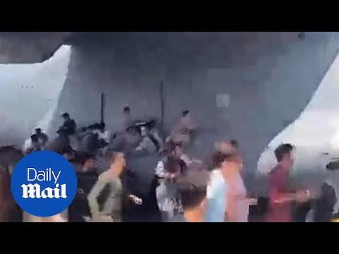 Afghanistan: Shocking moment people cling onto military plane wing at Kabul airport